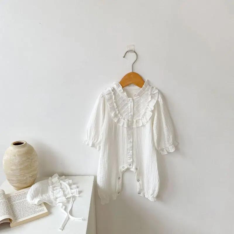 Adorable white baby romper with a ruffled collar and button closures A&S Collection
