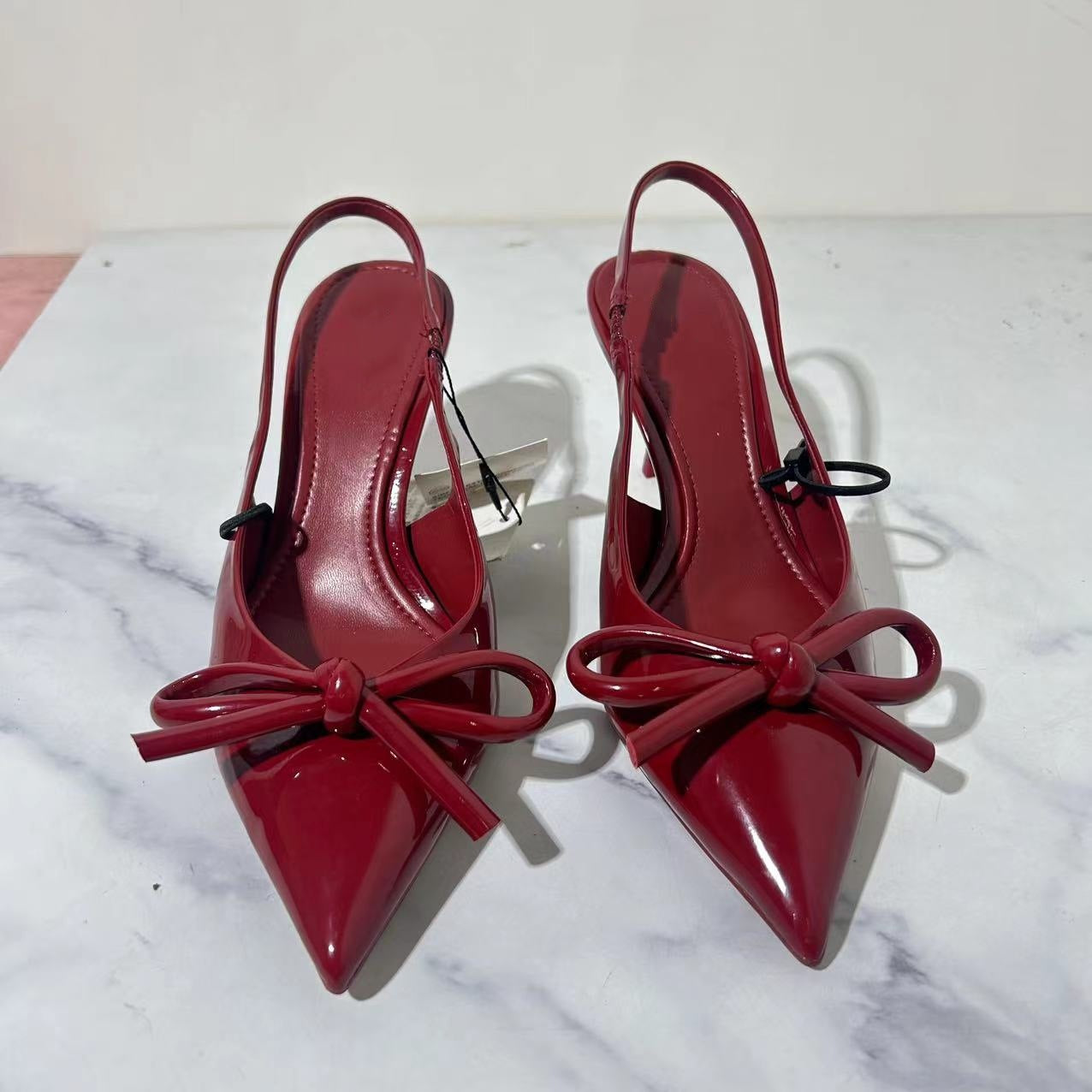 Point Toe Slingback Pumps.