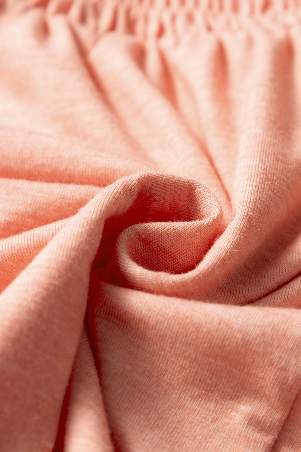 Smocked Front V Neck Short Sleeve Top.