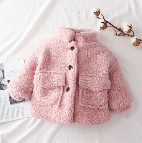 Cozy pink baby jacket with black buttons, perfect for a stylish and warm look A&S Collection