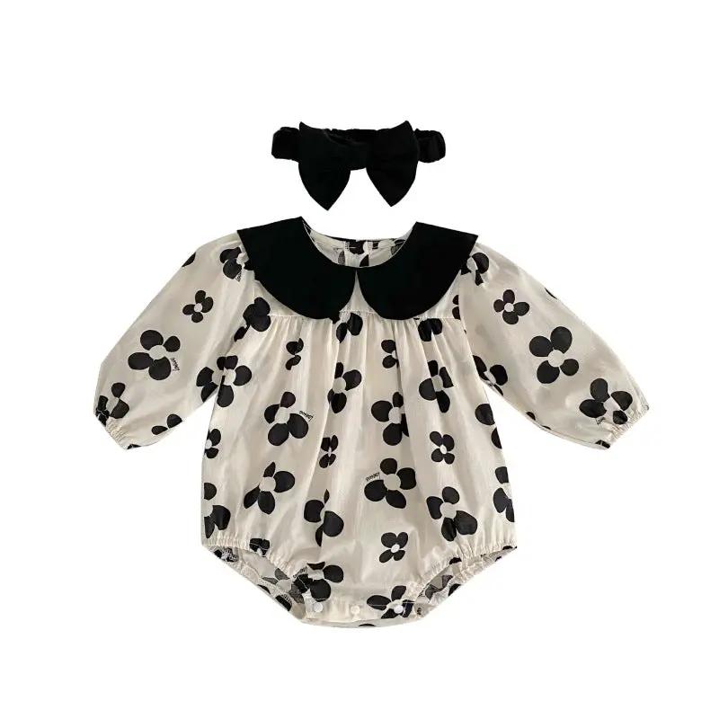 Adorable baby romper with a black floral pattern and matching headband, perfect for a chic and stylish look A&S Collection