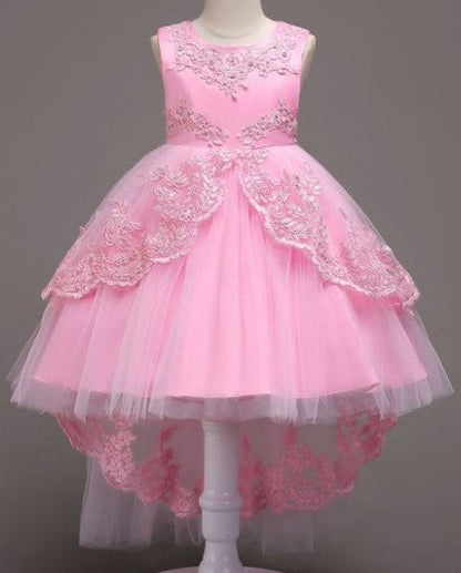 Elegant white flower girl dress with intricate lace and high-low hem. A&S Collection