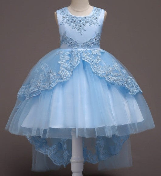 Elegant white flower girl dress with intricate lace and high-low hem. A&S Collection
