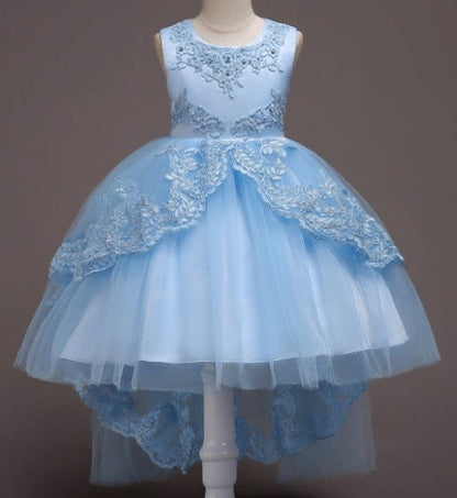 Elegant white flower girl dress with intricate lace and high-low hem. A&S Collection