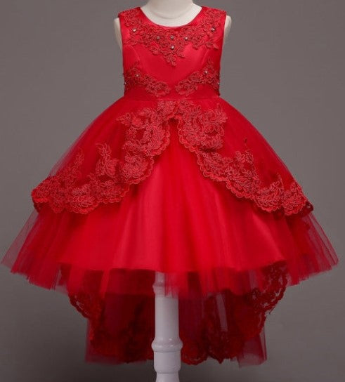 Elegant white flower girl dress with intricate lace and high-low hem. A&S Collection