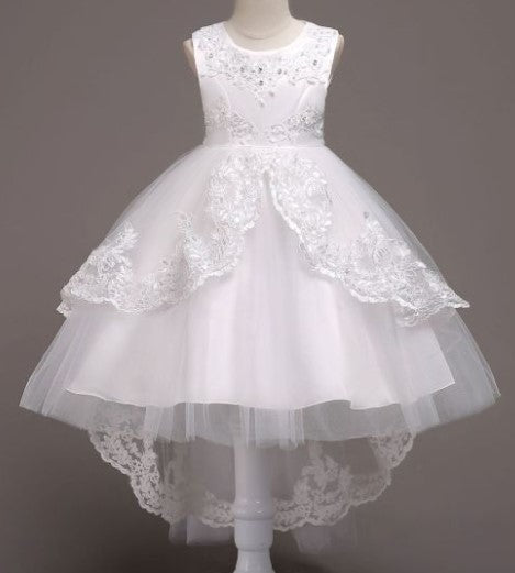 Elegant white flower girl dress with intricate lace and high-low hem. A&S Collection