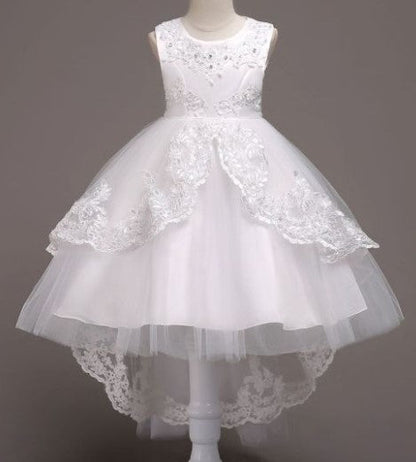 Elegant white flower girl dress with intricate lace and high-low hem. A&S Collection