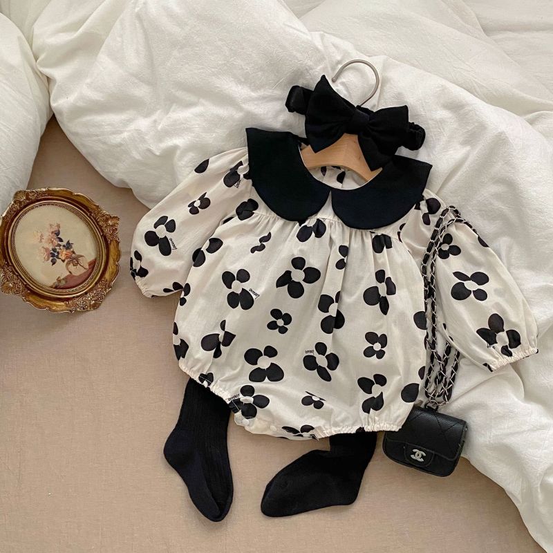 Adorable baby romper with a black floral pattern and matching headband, perfect for a chic and stylish look A&S Collection