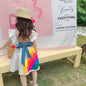 Vibrant rainbow dress with a pink bow, perfect for brightening any child's wardrobe. A&S Collection