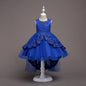 Elegant white flower girl dress with intricate lace and high-low hem. A&S Collection
