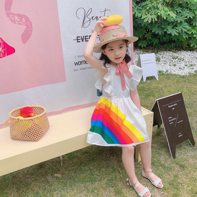 Vibrant rainbow dress with a pink bow, perfect for brightening any child's wardrobe. A&S Collection
