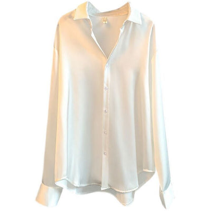 Elegant silk blouses in white, beige, olive, and black, neatly hung on wooden hangers A&S Collection