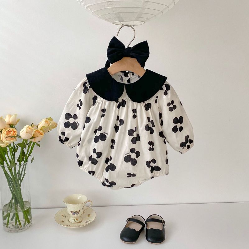 Adorable baby romper with a black floral pattern and matching headband, perfect for a chic and stylish look A&S Collection