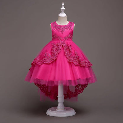 Elegant white flower girl dress with intricate lace and high-low hem. A&S Collection