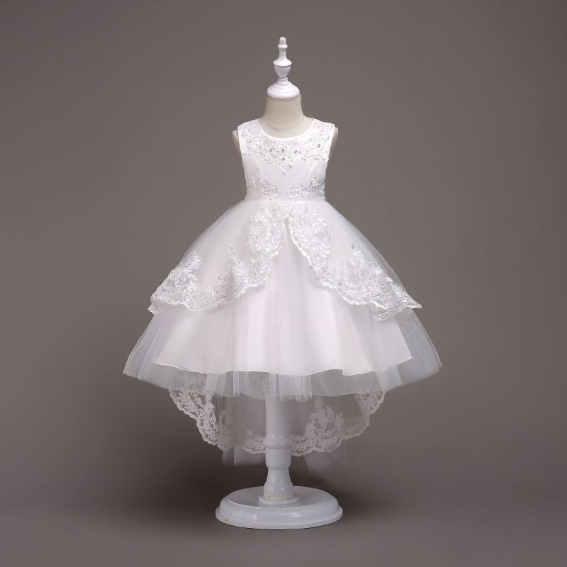 Elegant white flower girl dress with intricate lace and high-low hem. A&S Collection