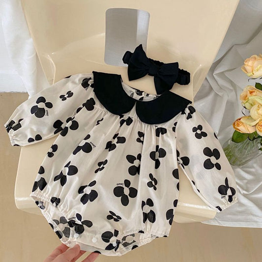 Adorable baby romper with a black floral pattern and matching headband, perfect for a chic and stylish look A&S Collection