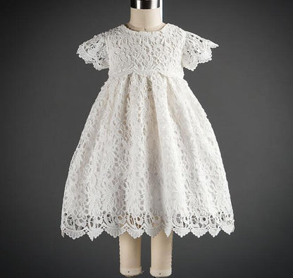 Elegant white lace dress with intricate patterns, short sleeves, and a scalloped hem for a timeless, classic look A&S Collection