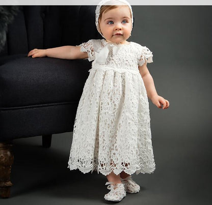 Elegant white lace dress with intricate patterns, short sleeves, and a scalloped hem for a timeless, classic look A&S Collection