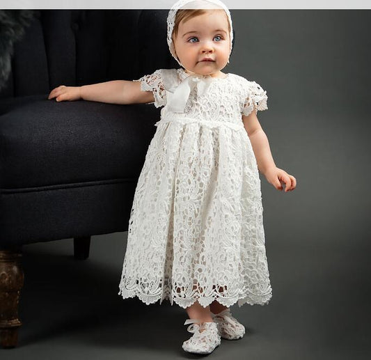 Elegant white lace dress with intricate patterns, short sleeves, and a scalloped hem for a timeless, classic look A&S Collection