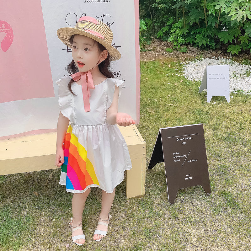 Vibrant rainbow dress with a pink bow, perfect for brightening any child's wardrobe. A&S Collection