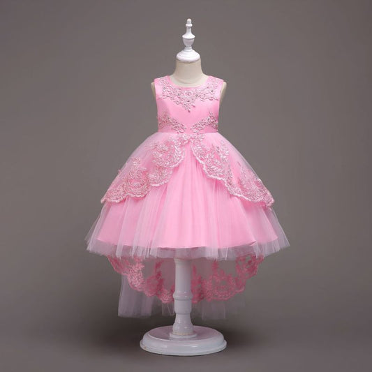 Elegant white flower girl dress with intricate lace and high-low hem. A&S Collection
