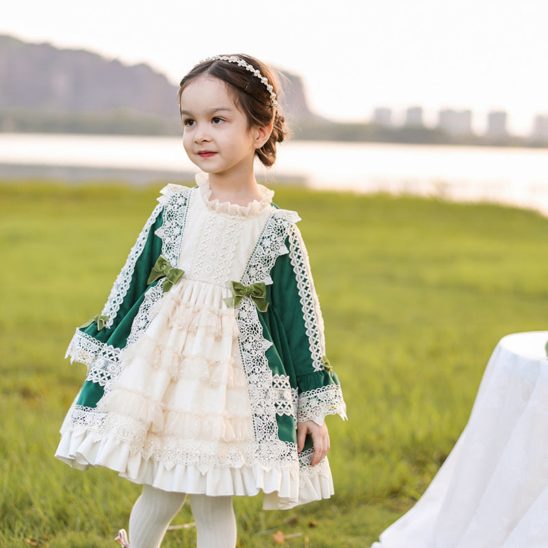 Charming Victorian-style dress with green and white lace and intricate bows. A&S Collection