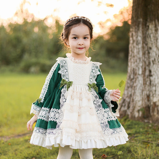 Charming Victorian-style dress with green and white lace and intricate bows. A&S Collection