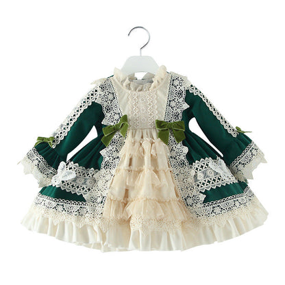Charming Victorian-style dress with green and white lace and intricate bows. A&S Collection